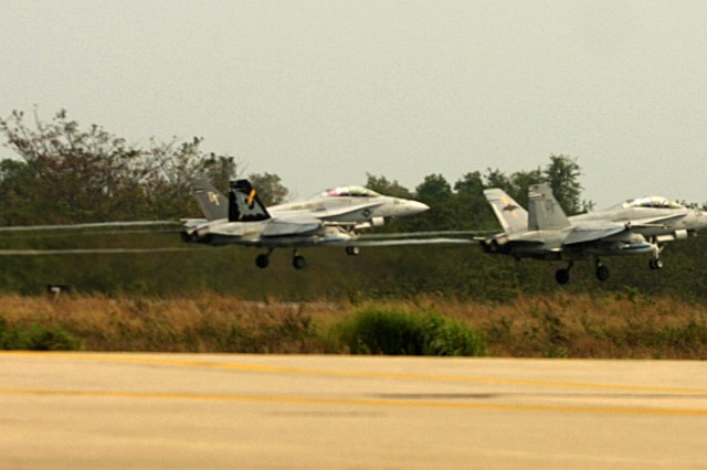 Two F/A-18 jets take off from Utaphao Airfield, Thailand Feb.