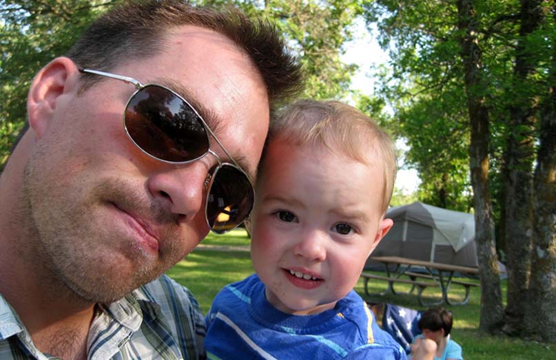 Clint Romesha with 1-year old son Collin, during a camping trip at Lake Metigoshe, N.D., in July of 2012.