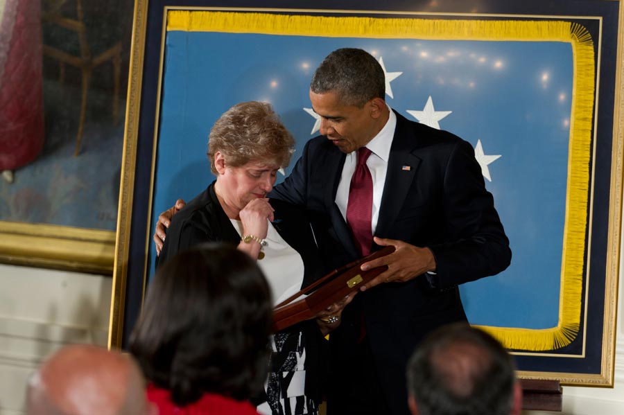 Rose Mary Brown, widow of Specialist Leslie H. Sabo Jr., accepts Sabo's Medal of Honor from President Obama