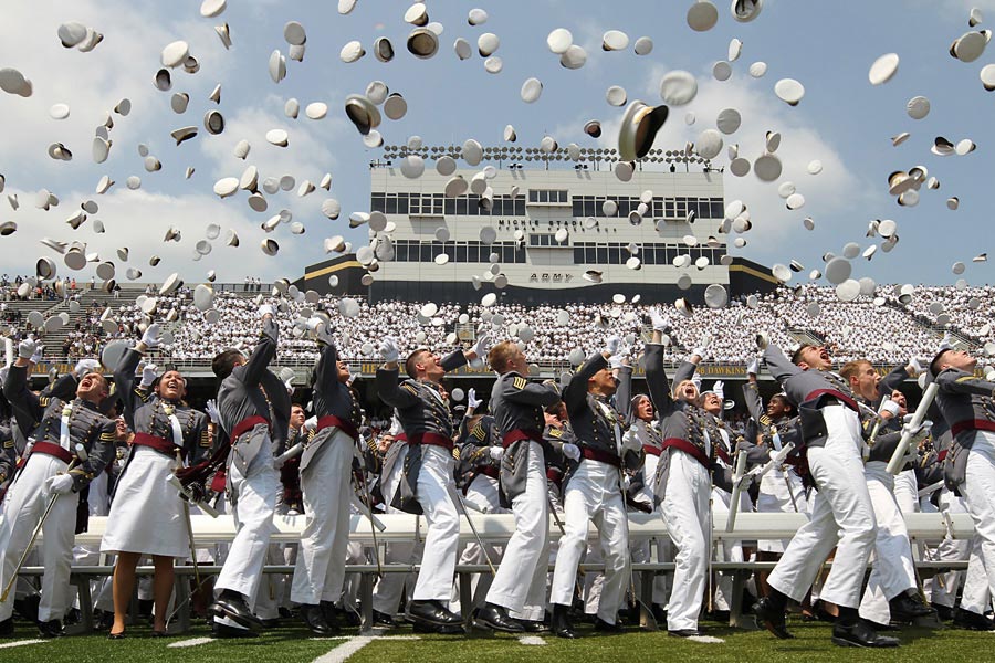 Class of 2012 cadets from the United States Military Academy at West Point toss their hats