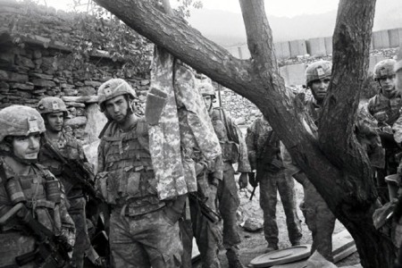 Group of Soldiers standing near a tree