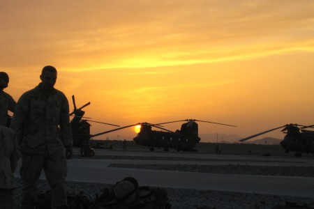 Soldiers and heliocopters at sunset