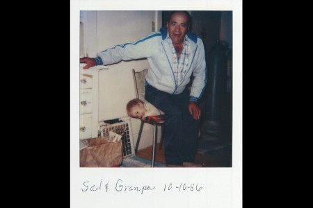 Grampa pretending to sit on Salvatore Giunta as a child
