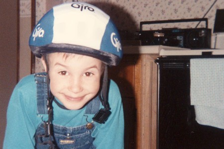 A young Salvatore Giunta wearing a bicycle helmet