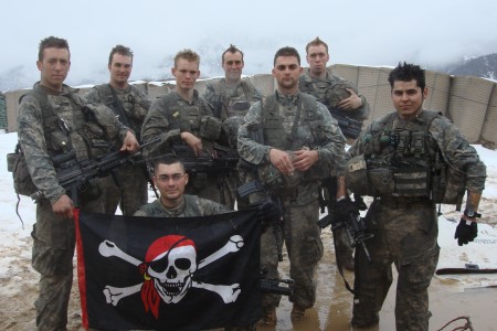 Soldiers holding pirate flag