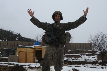 Salvatore Giunta standing with his hands up in his Army Uniform