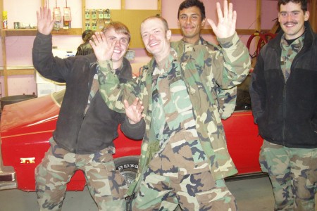 Soldiers with Staff Sergeant Robert Miller waving at the camera