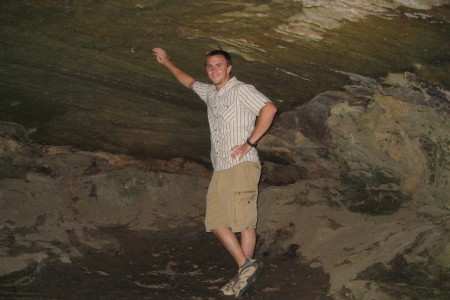 Staff Sergeant Robert Miller in a cave as a young adult