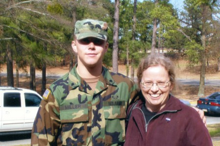 Staff Sergeant Robert Miller standing with his mother