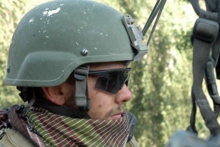 Close-up of Staff Sergeant Robert Miller with helmet and scarf on