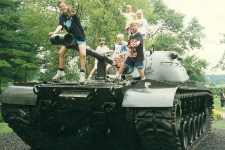 Children playing on a tank