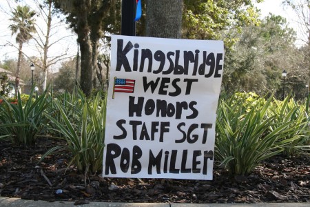 Road sign that says "Kingsbridge West Honors Staff Sergeant Robert Miller