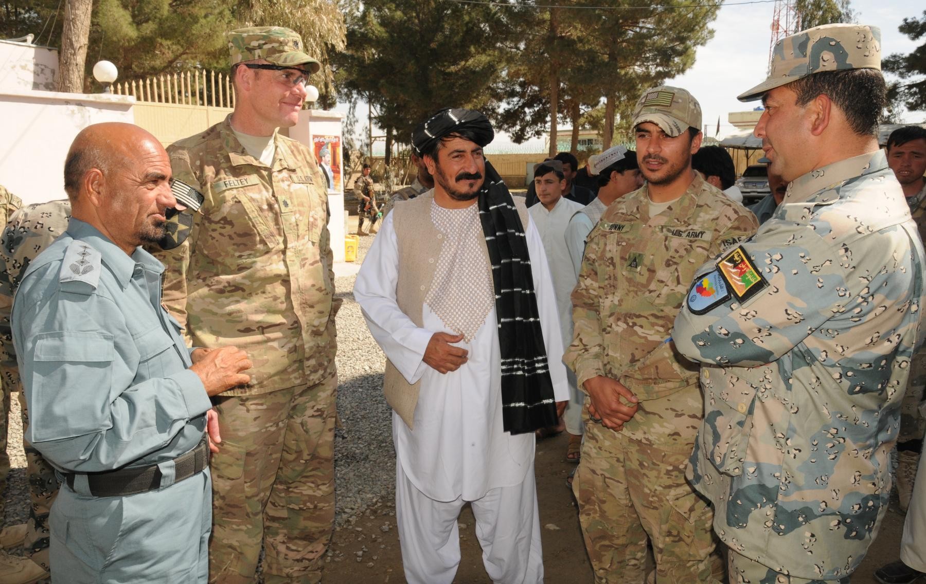 Local leaders in Afghan district meet each other, their 