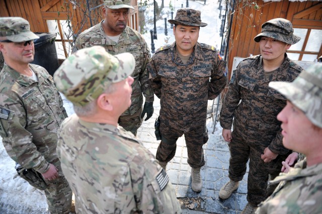 Gen. Frank Grass, the chief of the National Guard Bureau, talks with Mongolian soldiers serving in Afghanistan, Jan. 15, 2013. Mongolia is partnered with Alaska in the National Guard State Partnership Program.