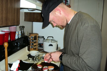 Sgt. Ty Carter makes sushi for his family at his apartment near Joint Base Lewis-McChord, Wash., in February 2012.