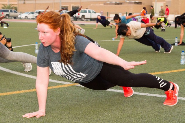 Pfc. Shelby Sullenger, a supply clerk with the 10th Combat Support Hospital, participates in a High Intensity Interval Training class as part of the unit's monthly fitness challenge on Camp Arifjan, Kuwait, March 5, 2016. The hospital uses these monthly events to help their Soldiers get and stay fit while increasing the esprit de corps of the unit. (U.S. Army photo by Sgt. David N. Beckstrom, 19th Public Affairs Detachment, U.S. Army Central)