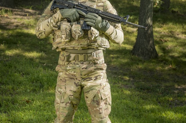 Natick's Robert DiLalla took a game-changing approach to develop the Ballistic Combat Shirt (pictured here under other protective gear). DiLalla focused on meeting the high-performance athletic needs of the Warfighter, resulting in a lighter weight, less bulky form of protection that doesn't hinder movement.
