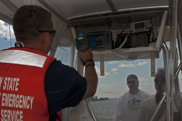 New York Army National Guard Staff Sgt. David Hansen, a survey chief from the New York National Guard's 2nd Civil Support Team, uses an Identifinder to check for radioactive materials aboard a suspect boat during Operation Clear Passage, a three-day, multi-agency homeland security exercise and water quality/navigational-boating enforcement event held on Lake Champlain from July 22 to 24. During the operation, 2nd Civil Support Team members successfully found radiation sources on a boat and parked cars in and around the lake.