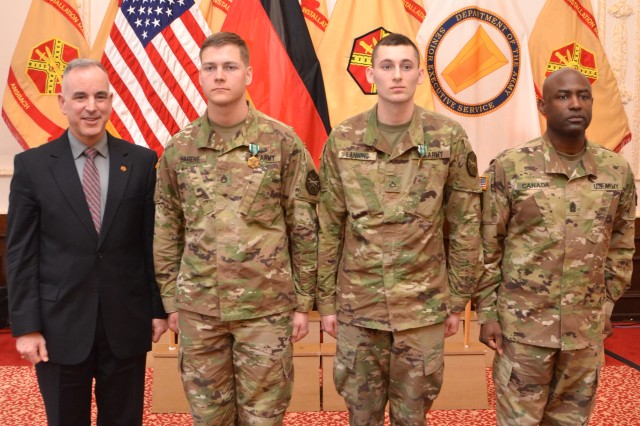Michael Formica, left, director of Installation Management Command - Europe, and Command Sgt. Maj. Gene Canada, right, IMCOM-Europe command sergeant major, stand with the 2017 IMCOM-Europe Best Warrior Competition noncommissioned officer and Soldier winners during an awards ceremony in Ansbach, Germany, March 23, 2017. Second from left is Staff Sgt. Brendan Hagens of U.S. Army Garrison Wiesbaden, and second from right is Pfc. Douglas Lanning of USAG Benelux.
