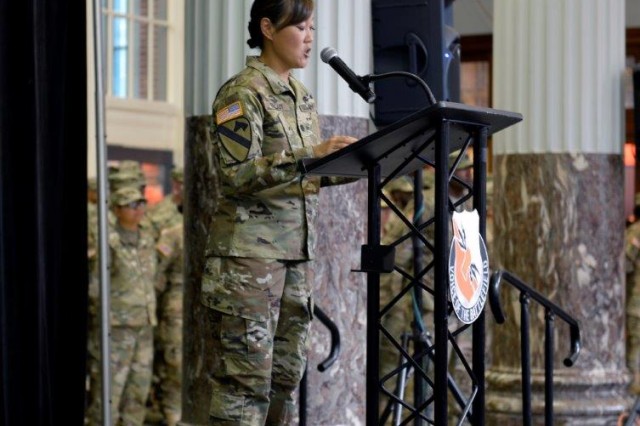Texas Army National Guard Lt. Col. Tanya Trout, then commander for the 136th Expeditionary Signal Battalion, congratulates her Soldiers on their successful mission during a ceremony Aug. 5, 2016. The signal battalion completed a successful nine-month tour in Kuwait and surrounding areas providing communication capabilities in support of Operation Inherent Resolve, Operation Freedom Resolve and Operation Spartan Shield.