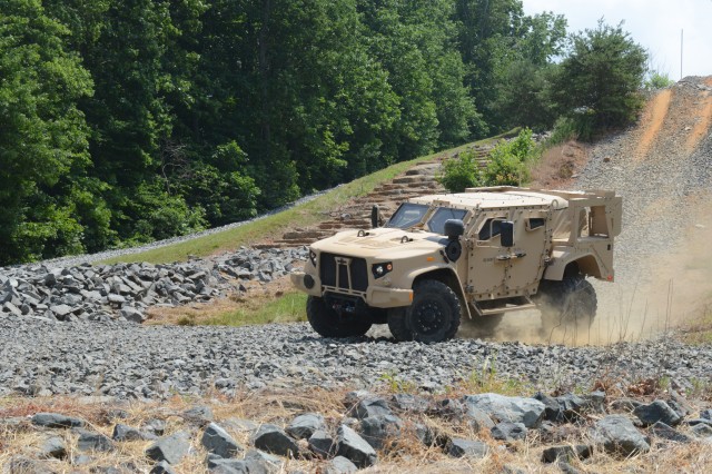 A Joint Light Tactical Vehicle does a demonstration run around Marine Corps Base Quantico, Va., June 14, 2017.