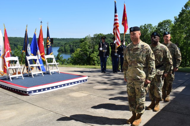 (Left to right) Col. James Hooper, outgoing commander of Crane Army Ammunition Activity, Brig. Gen. Richard Dix, commanding general of Joint Munitions Command, and Col. Michael Garlington, incoming commander of CAAA, march into Crane Army's change of command ceremony on June 19.