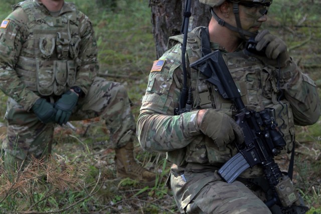 John Schannep (left), a U.S. Military Academy cadet and native of Tucson, Arizona, shadows 1st Lt. Charles Gough, a platoon leader with Chaos Company, 1st Battalion, 68th Armor Regiment, 3rd Armored Brigade Combat Team, 4th Infantry Division, during a platoon live-fire exercise at Grafenwoehr Training Area, Germany, July 28, 2017. A group of West Point cadets are spending three weeks in Germany training with the Iron Brigade as it hones readiness in support of Operation Atlantic Resolve. (Photo by Staff Sgt. Ange Desinor, 3rd Armored Brigade Combat Team, 4th Infantry Division)