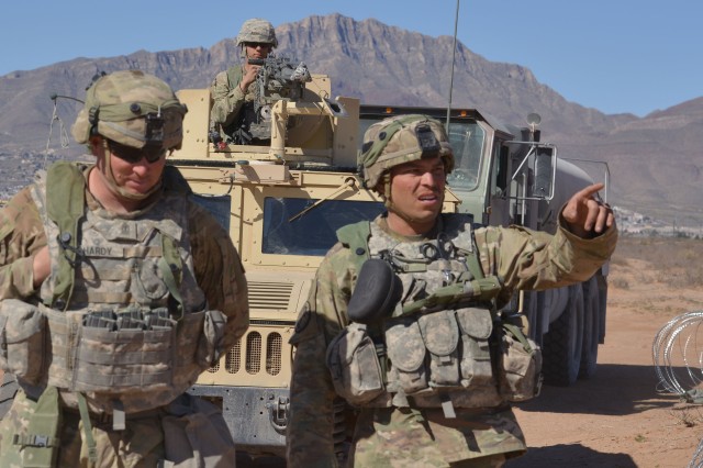 First Lieutenant Vicente Trejo, 11th Air Defense Artillery Brigade (right) talks with 1st Sgt. Jacob Allen Hardy (left) during the 2018 Roving Sands exercise held at Fort Bliss, Texas and White Sands, New Mexico. Trejo served five years in the Marine Corps as an aviation operations specialist before commissioning into the Army in 2016.