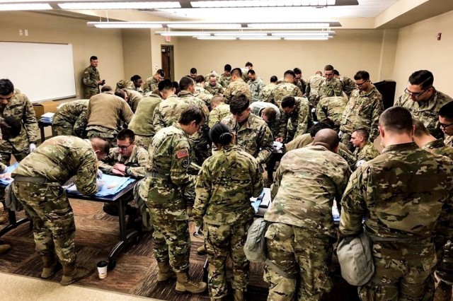 CAMP HUMPHREYS, Republic of Korea - Combat medic specialists with Headquarters and Headquarters Company, 3rd Armored Brigade Combat Team, 1st Armored Division (Rotational),  congregate at U.S. Army Garrison Camp Humphreys for advanced medical training, Feb. 14. Suturing is a perishable skill that takes practice. An inexperienced combat medic specialist may leave a lasting scar. (Courtesy U.S. Army photo by Sgt. 1st Class Yu Rhee, 3rd ABCT, 1st AD, Medical Operations NCO)