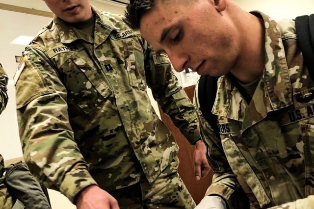 CAMP HUMPHREYS, Republic of Korea - Cpt. Nicholas Rathjen, San Antonio, Texas native, physician, Headquarters and Headquarters Company, 1st Battalion, 77th Armor Regiment, 3rd Armored Brigade Combat Team, 1st Armored Division (Rotational), points out the incision  belt to 1st Lt. Timothy Myers, Kalamazoo, Michigan native, medical operations officer, HHC, 1-77th AR, 3rd ABCT, 1st AD. Combat Medic Specialist training is designed for medics to  help their technical skills to sustain life on the battlefield. (Courtesy U.S. Army photo by Sgt. 1st Class Yu Rhee, 3rd ABCT, 1st AD, Medical Operations NCO)