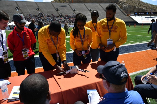 Unable to fly their unmanned aerial vehicle due to technical difficulties, the team of undergraduate students from Tuskegee University explain the design of their UAV to the judging panel during the U.S. Army's inaugural HBCU/MI Design Competition held at the University of Texas at El Paso's Sun Bowl Stadium April 23-24, 2019. The competition, led by the U.S. Army Combat Capabilities Development Command, challenged 11 undergraduate student teams from historically black colleges and universities and other minority serving institutions (HBCUs/MIs) to develop solutions to real-world technical challenges faced by U.S. Army researchers in the area of unmanned aerial vehicles, commonly called drones.