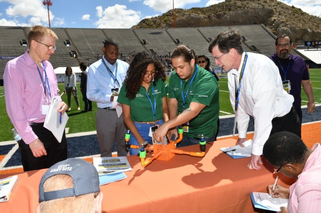 Unable to fly their unmanned aerial vehicle due to technical difficulties, undergraduate students from the University of Puerto Rico Mayaguez explain their UAV design to the judging panel during the U.S. Army's inaugural HBCU/MI Design Competition held at the University of Texas at El Paso's Sun Bowl Stadium April 23-24, 2019.The competition, led by the U.S. Army Combat Capabilities Development Command, challenged 11 undergraduate student teams from historically black colleges and universities and other minority serving institutions (HBCUs/MIs) to develop solutions to real-world technical challenges faced by U.S. Army researchers in the area of unmanned aerial vehicles, commonly called drones.
