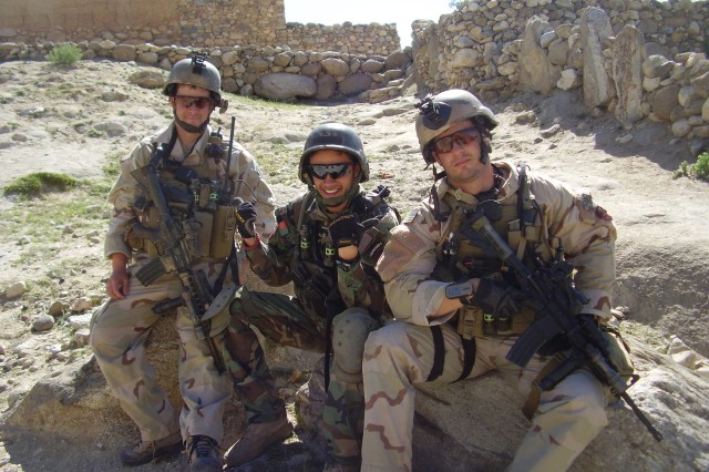 Then-Sgt. Matthew Williams with Staff Sgt. Ronald Shurer II assigned to 3rd Special Forces Group (Airborne), sit outside a small village in Eastern Afghanistan in May 2008.