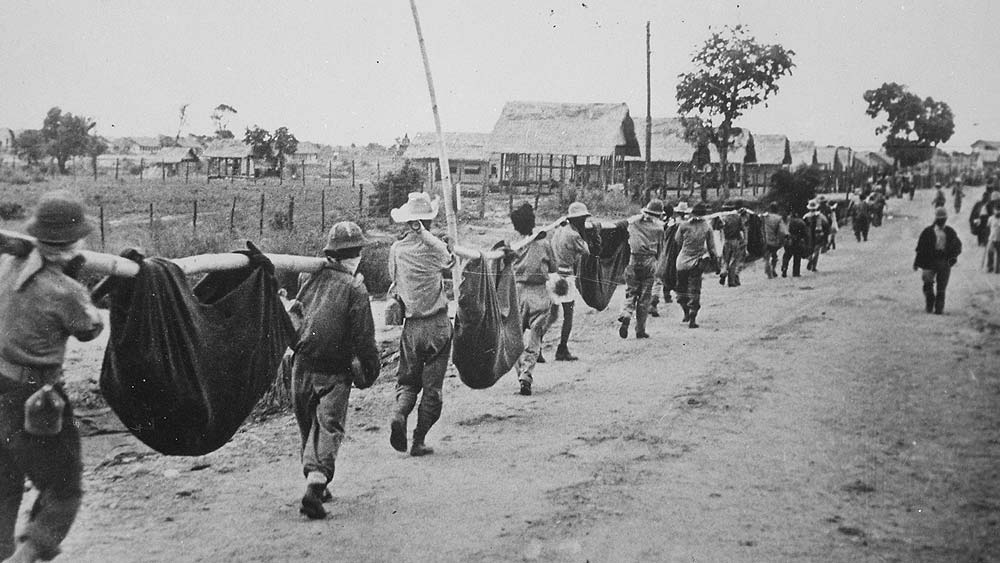 Soldiers use improvised bodybags to carry the fallen - Battan Death March 1942