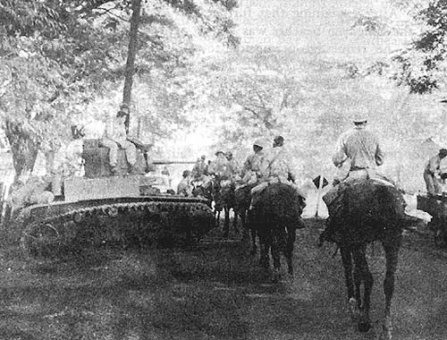 6th Cavalry (PS) [Philippine Scouts] moving into Pozorrubio pass a General Stuart light tank, M3.