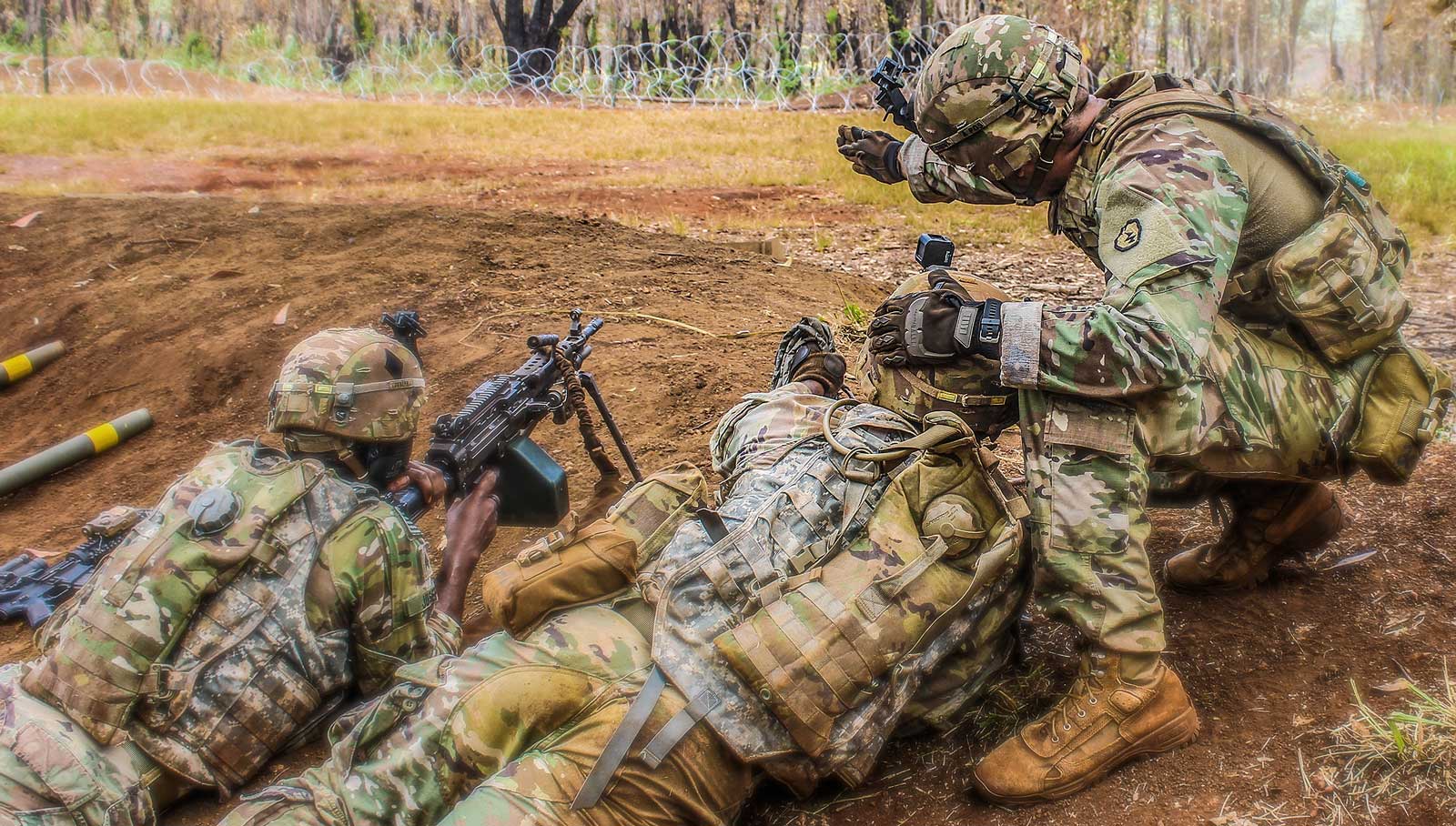 Image: U.S. Army 1st Lt. Thomas H. Tockarshewsky assigned to Alpha Company, 2nd Infantry Brigade Combat Team, 25th Infantry Division, gives guidance to his grappling man during a combined arms live-fire exercise at Schofield Barracks, Hawaii, June 24, 2020. The exercise is part of an overall training progression in order to maintain combat readiness in preparation for a Joint Readiness Training Center rotation later this year. (U.S. Army photo by 1st Sgt. Lekendrick Stallworth)