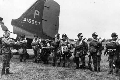 Paratroopers receive final instructions before leaving for Normandy.