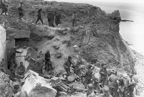 Relief forces reached the Rangers at Point Du Hoe. The American flag had been spread out to stop fire of friendly tanks coming from inland.