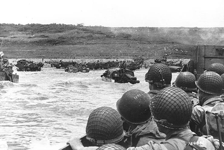 Soldiers crowd a landing craft on their way to Omaha Beach