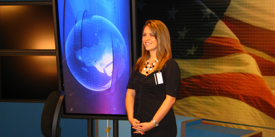 Department of Army Intern, Kayla Munro, prepares for a video broadcast