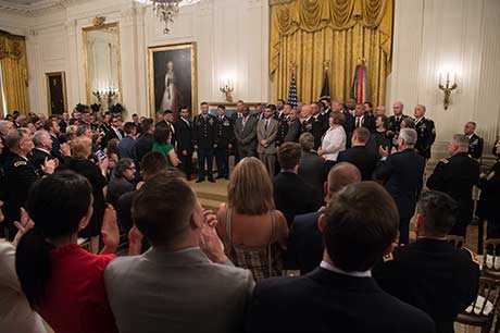 Members of Staff Sgt David G. Bellavia’s unit joins him after President Donald J. Trump presents the Medal of Honor during a ceremony at the White House in Washington, D.C., June 25, 2019. Bellavia was awarded the Medal of Honor for actions while serving as a squad leader with the 1st Infantry Division in support of Operation Phantom Fury in Fallujah, Iraq when a squad from his platoon became trapped by intense enemy fire. (U.S. Army Photo by Sgt. Kevin Roy)