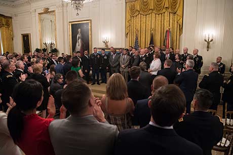 Members of Staff Sgt David G. Bellavia’s unit joins him after President Donald J. Trump presents the Medal of Honor during a ceremony at the White House in Washington, D.C., June 25, 2019. Bellavia was awarded the Medal of Honor for actions while serving as a squad leader with the 1st Infantry Division in support of Operation Phantom Fury in Fallujah, Iraq when a squad from his platoon became trapped by intense enemy fire. (U.S. Army Photo by Sgt. Kevin Roy)