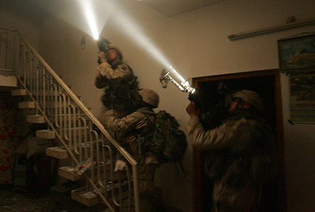 Soldiers of 1st Platoon, Alpha Company, enter and clear a building during heavy fighting, Nov. 9, 2004, in the Askari District of North Eastern Fallujah. (Photo courtesy of David Bellavia)