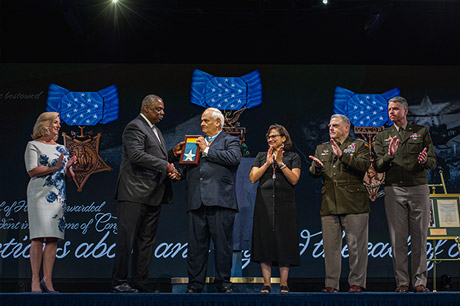 Secretary of Defense Lloyd J. Austin III presents the Medal of Honor flag to former Army Spc. Five Dwight
W. Birdwell, in a ceremony in which Birdwell and five other Medal of Honor recipients were inducted
into the Pentagon Hall of Heroes, at Joint Base Myer-Henderson Hall, Va., July 6, 2022. (U.S. Army photo
by Sgt. Henry Villarama)