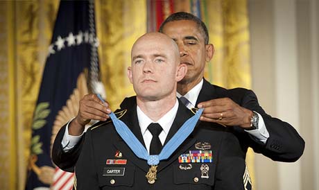 U.S. Army Staff Sgt. Ty Michael Carter receives the Medal of Honor from President Barack Obama during a ceremony at the White House in Washington, D.C., Aug. 26, 2013. U.S. Army photo by Staff Sgt. Bernardo Fuller.