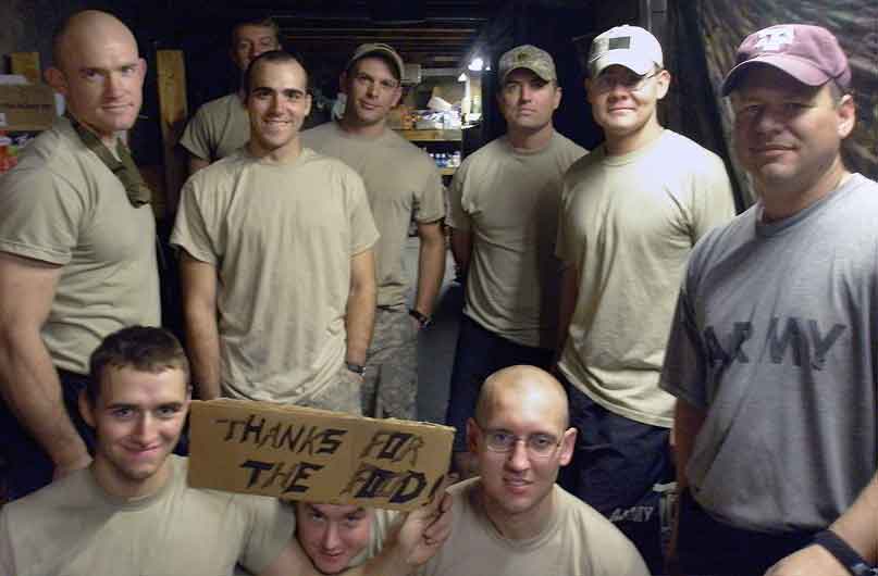 Clockwise from top left: Spc. Ty Carter, Spc. Cody Floyd, Spc. Christopher T. Griffin, Sgt. Eric Harder, Sgt. John Francis, Staff Sgt. Kirk Birchfield, Sgt. Scott Potempa, Spc. Michael Scusa, Pvt. Edward Faulkner and Pfc. Daniel Rogers gather for a “thank you” photo at Combat Outpost Keating, August 2009, for the canned foods donated by Harder's mother and her friends. Soldiers had a very limited diet at the remote outpost, with hot food being rare. Courtesy photo.
