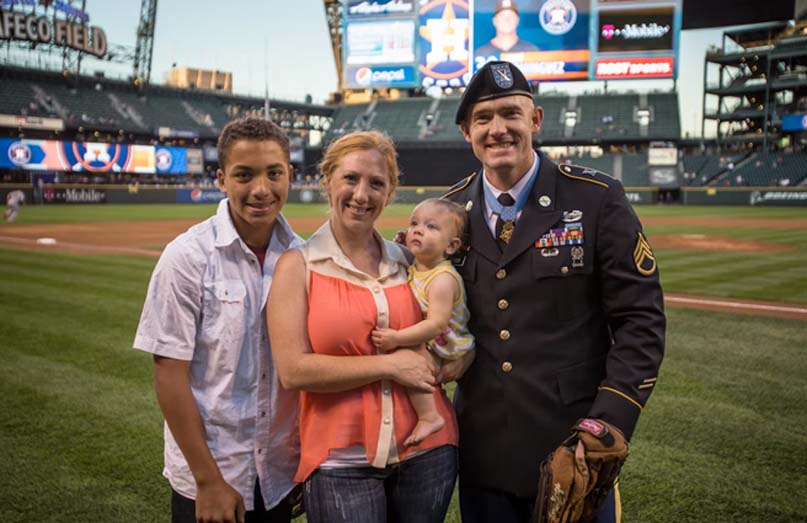 Army Staff Sgt. Ty Carter, a Medal of Honor recipient, poses for a photo with his family after throwing the ceremonial first pitch during the Seattle Mariners vs. Houston Astros game at Safeco Field in Seattle, Sept. 11, 2013. Photo courtesy of the Carter family.