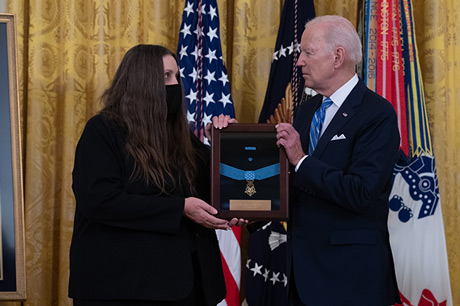 President Joseph R. Biden Jr. presents the Medal of Honor to Tamara Cashe, the spouse of U.S. Army Sgt. 1st Class Alwyn C. Cashe, during a ceremony at the White House in Washington, D.C., Dec. 16, 2021. Sgt. 1st Class Cashe was posthumously awarded the Medal of Honor for actions of valor during Operation Iraqi Freedom while serving as a platoon sergeant with Alpha Company, 1st Battalion, 15th Infantry Regiment, 3rd Infantry Division, in Salah Ad Din province, Iraq, on Oct. 17, 2005. (U.S. Army photo by Laura Buchta)