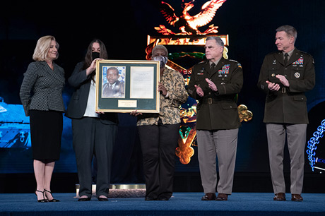 Secretary of the U.S. Army Christine E. Wormuth, Chairman of the Joint Chiefs of Staff U.S. Army Gen. Mark A. Milley and Chief of Staff of the U.S. Army Gen. James C. McConville present the Medal of Honor plaque to Tamara Cashe, the spouse of U.S. Army Sgt. 1st Class Alwyn C. Cashe, and Kasinal Cashe White, the sister of Sgt. 1st Class Cashe, during a Medal of Honor Induction Ceremony at Joint Base Myer-Henderson Hall, Va., Dec. 17, 2021. Sgt. 1st Class Cashe was posthumously awarded the Medal of Honor for actions of valor during Operation Iraqi Freedom while serving as a platoon sergeant with Alpha Company, 1st Battalion, 15th Infantry Regiment, 3rd Infantry Division, in Salah Ad Din province, Iraq, on Oct. 17, 2005. (U.S. Army photo by Laura Buchta)