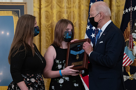 President Joseph R. Biden Jr. presents the Medal of Honor to Katherine Celiz, spouse of U.S. Army Sgt. 1st Class Christopher A. Celiz, and their daughter Shannon, during a ceremony at the White House in Washington, D.C., Dec. 16, 2021. Sgt. 1st Class Celiz was posthumously awarded the Medal of Honor for actions of valor during Operation Freedom’s Sentinel while serving as a battalion mortar platoon sergeant with Company D, 1st Battalion, 75th Ranger Regiment, in Paktiya province, Afghanistan, on July 12, 2018. (U.S. Army photo by Laura Buchta)